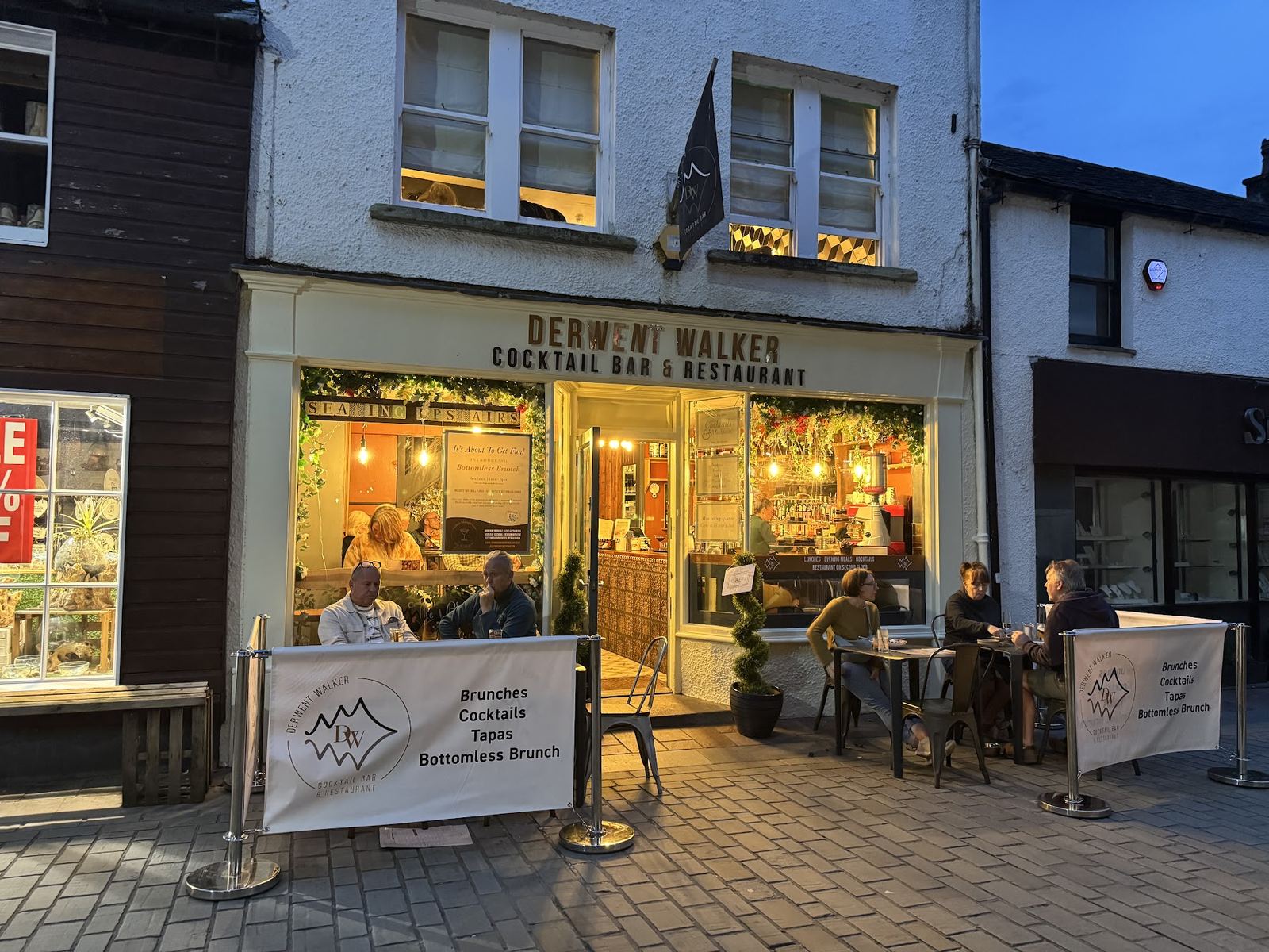 Derwent Walker Cocktail Bar and Restaurant on Lake Road, Keswick, at dusk